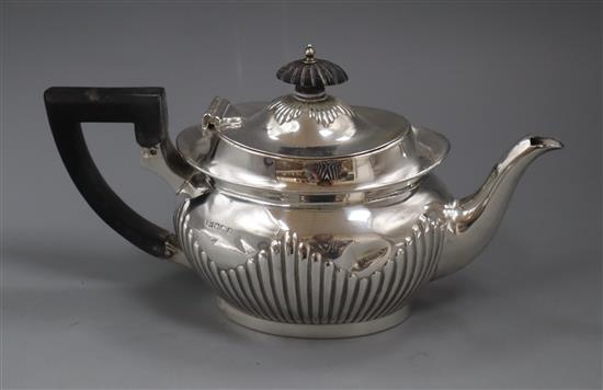 A late Victorian demi fluted silver teapot, Sheffield, 1896, gross 12.5 oz.